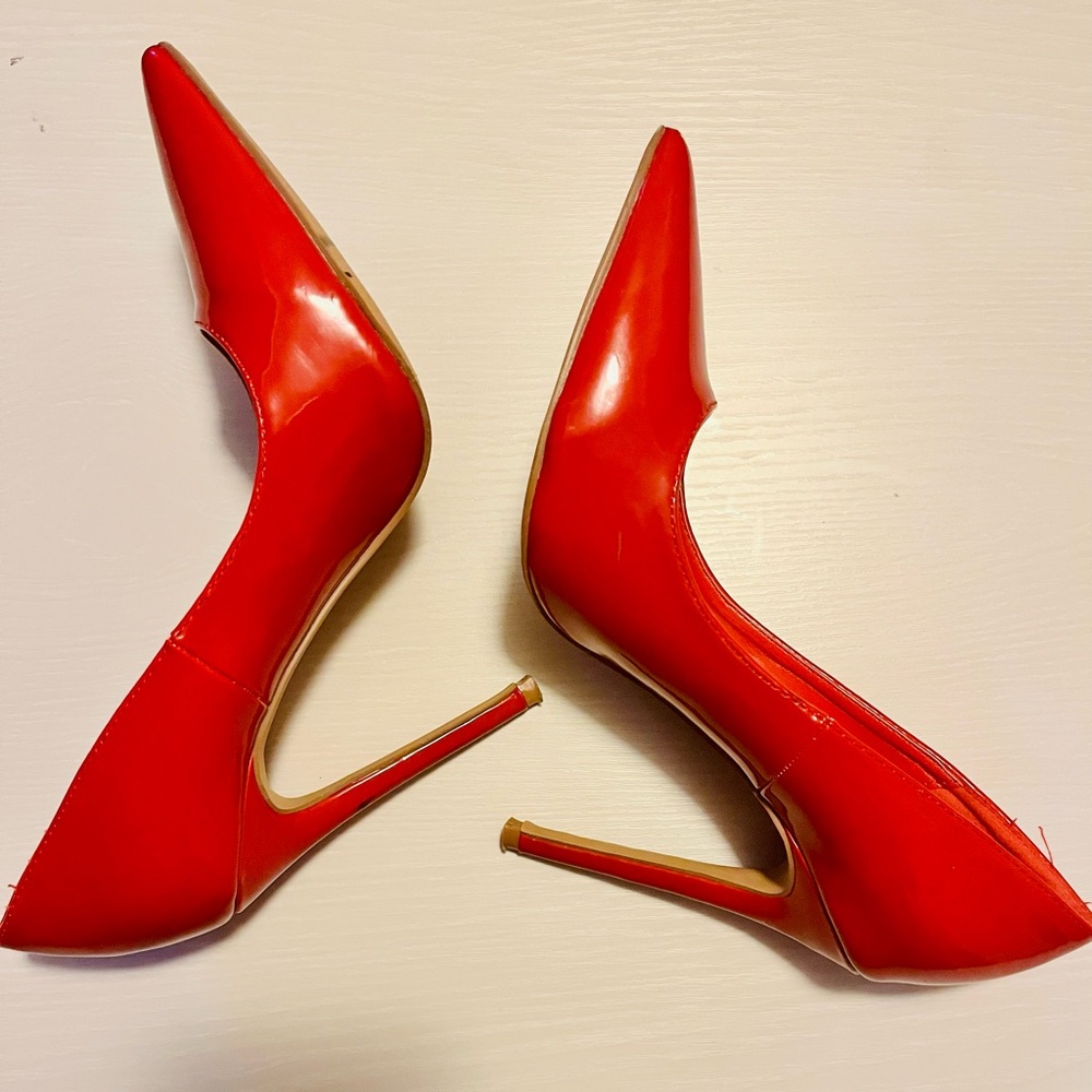 Red patent leather heel size 8 lightly worn. Runs small